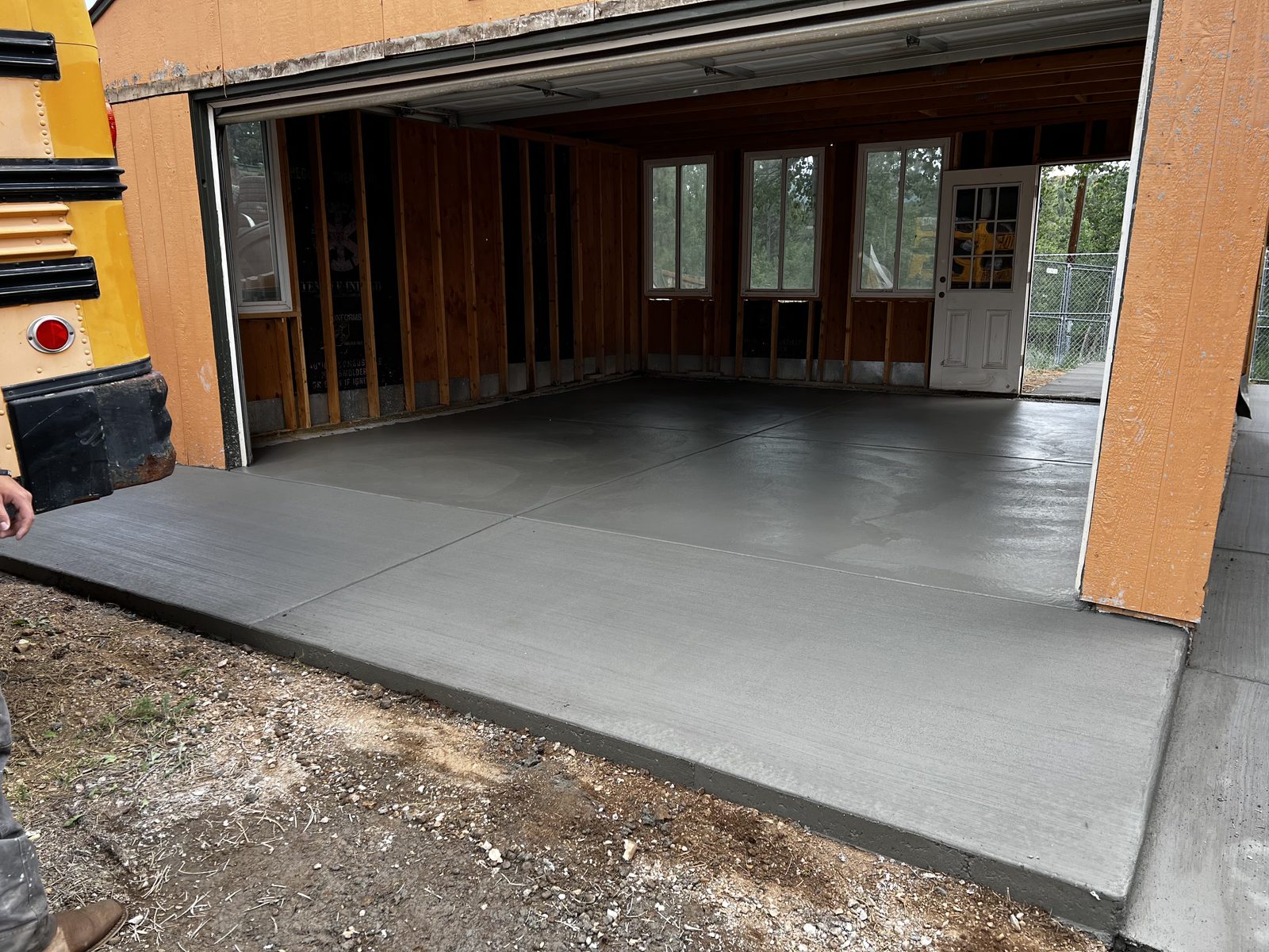 Large concrete slab poured on grade at a detached garage
