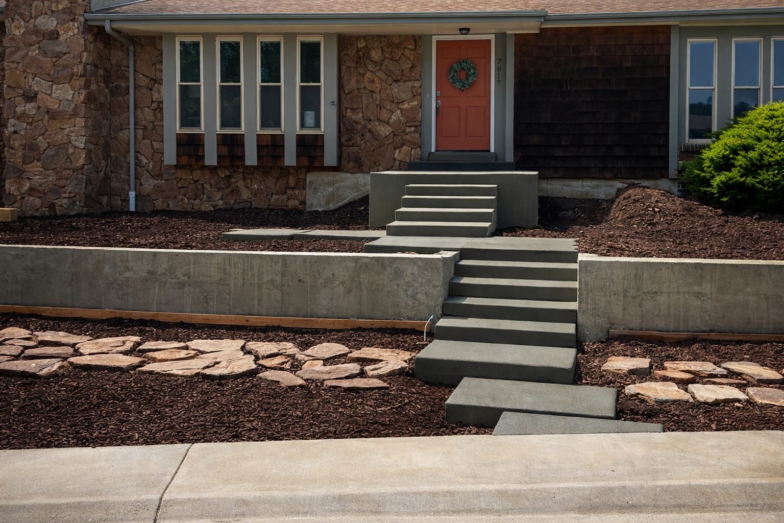 Poured concrete entry steps and board-formed retaining walls